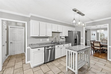 Welcome home to this lovely 3BR/2.5BA home in the desirable on Kings Grant Golf and Country Club in North Carolina - for sale on GolfHomes.com, golf home, golf lot