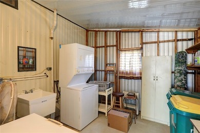 Just a short walk to the golf course, this well-maintained home on Barefoot Bay Golf Course in Florida - for sale on GolfHomes.com, golf home, golf lot