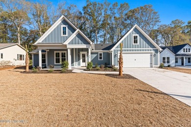 Beautiful new construction home located across from the waterway on Oyster Bay Golf Links in North Carolina - for sale on GolfHomes.com, golf home, golf lot