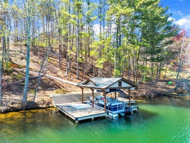 Welcome to this magnificent lakeside retreat located on Lake on The Highlands Course at Lake Arrowhead in Georgia - for sale on GolfHomes.com, golf home, golf lot