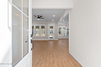 Beautiful new construction home located across from the waterway on Oyster Bay Golf Links in North Carolina - for sale on GolfHomes.com, golf home, golf lot