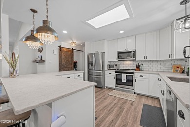 Feel instantly at home as you step into this bright, open on Harbour Point Golf Club in North Carolina - for sale on GolfHomes.com, golf home, golf lot