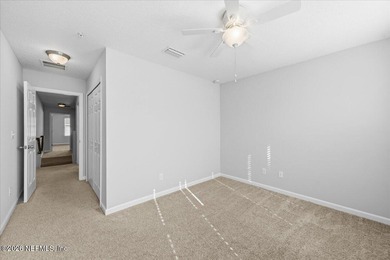 Step into a beautifully refreshed townhome in Segovia, where on Slammer and Squire Golf Course in Florida - for sale on GolfHomes.com, golf home, golf lot