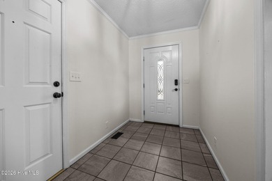 Welcome home to this beautifully updated single-level residence on Woodlake Country Club in North Carolina - for sale on GolfHomes.com, golf home, golf lot