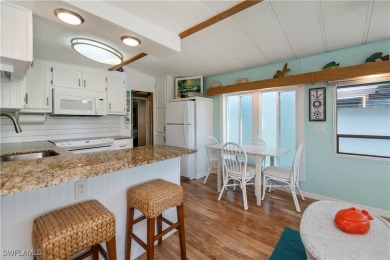 Beautifully maintained and upgraded remodeled lakefront on Del Tura Golf and Country Club in Florida - for sale on GolfHomes.com, golf home, golf lot