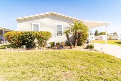 Welcome to your idyllic retreat at 1426 Whispering Pines Loop on Lily Lake Golf and RV Resort in Florida - for sale on GolfHomes.com, golf home, golf lot