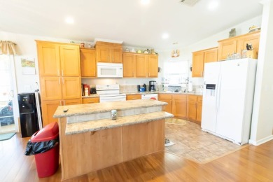 Welcome to your idyllic retreat at 1426 Whispering Pines Loop on Lily Lake Golf and RV Resort in Florida - for sale on GolfHomes.com, golf home, golf lot