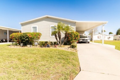 Welcome to your idyllic retreat at 1426 Whispering Pines Loop on Lily Lake Golf and RV Resort in Florida - for sale on GolfHomes.com, golf home, golf lot