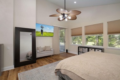 Beautifully updated with idyllic views of the fifteenth hole on Emerald Bay Golf Club in Florida - for sale on GolfHomes.com, golf home, golf lot