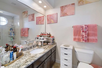 Beautifully updated with idyllic views of the fifteenth hole on Emerald Bay Golf Club in Florida - for sale on GolfHomes.com, golf home, golf lot
