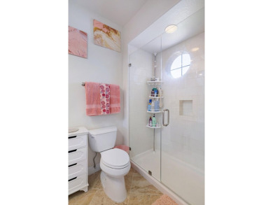 Beautifully updated with idyllic views of the fifteenth hole on Emerald Bay Golf Club in Florida - for sale on GolfHomes.com, golf home, golf lot