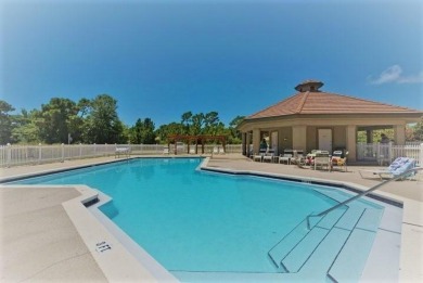 Beautifully updated with idyllic views of the fifteenth hole on Emerald Bay Golf Club in Florida - for sale on GolfHomes.com, golf home, golf lot