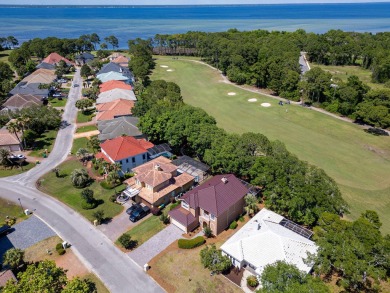 Beautifully updated with idyllic views of the fifteenth hole on Emerald Bay Golf Club in Florida - for sale on GolfHomes.com, golf home, golf lot