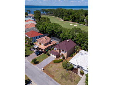Beautifully updated with idyllic views of the fifteenth hole on Emerald Bay Golf Club in Florida - for sale on GolfHomes.com, golf home, golf lot