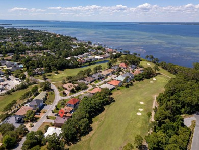 Beautifully updated with idyllic views of the fifteenth hole on Emerald Bay Golf Club in Florida - for sale on GolfHomes.com, golf home, golf lot