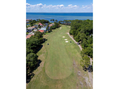 Beautifully updated with idyllic views of the fifteenth hole on Emerald Bay Golf Club in Florida - for sale on GolfHomes.com, golf home, golf lot