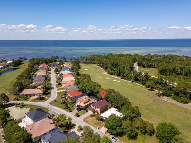 Beautifully updated with idyllic views of the fifteenth hole on Emerald Bay Golf Club in Florida - for sale on GolfHomes.com, golf home, golf lot