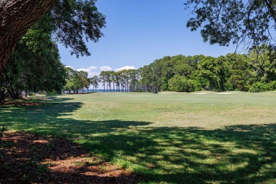 Beautifully updated with idyllic views of the fifteenth hole on Emerald Bay Golf Club in Florida - for sale on GolfHomes.com, golf home, golf lot