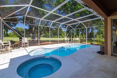 Beautifully updated with idyllic views of the fifteenth hole on Emerald Bay Golf Club in Florida - for sale on GolfHomes.com, golf home, golf lot
