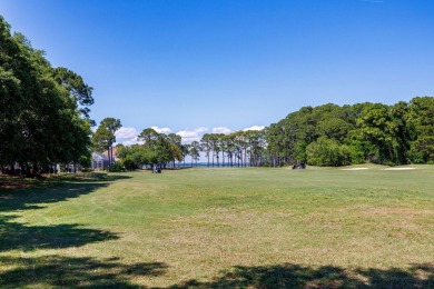 Beautifully updated with idyllic views of the fifteenth hole on Emerald Bay Golf Club in Florida - for sale on GolfHomes.com, golf home, golf lot