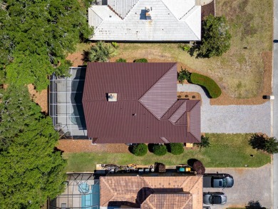 Beautifully updated with idyllic views of the fifteenth hole on Emerald Bay Golf Club in Florida - for sale on GolfHomes.com, golf home, golf lot
