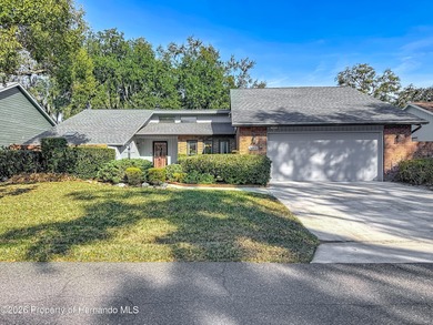 Welcome to your dream home in Whispering Oaks, where comfort on The Ridge Manor Oaks Golf and Country Club in Florida - for sale on GolfHomes.com, golf home, golf lot