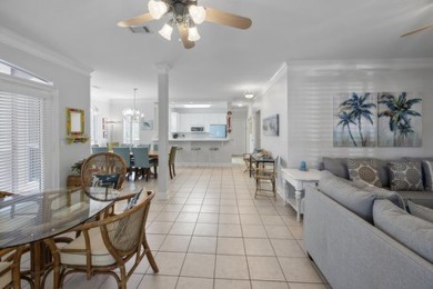 Discover coastal living at its finest in this elegant on Regatta Bay Golf and Country Club in Florida - for sale on GolfHomes.com, golf home, golf lot