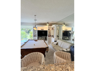 Fabulous 4 bed 3 bath home in prestigious Tiffany Trace located on The Boca Country Club in Florida - for sale on GolfHomes.com, golf home, golf lot