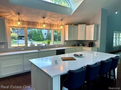 Presenting a beautifully remodeled Craftsman-style home that on Orchard Lake Country Club in Michigan - for sale on GolfHomes.com, golf home, golf lot