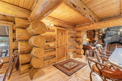 An extraordinary log home surrounded by mature trees and on Red Lodge Golf Club in Montana - for sale on GolfHomes.com, golf home, golf lot
