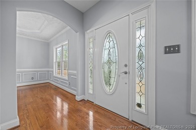 Enjoy outdoor living at its finest with a screened porch on Carolina Lakes Country Club in North Carolina - for sale on GolfHomes.com, golf home, golf lot