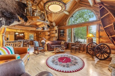 An extraordinary log home surrounded by mature trees and on Red Lodge Golf Club in Montana - for sale on GolfHomes.com, golf home, golf lot