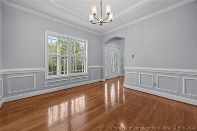 Enjoy outdoor living at its finest with a screened porch on Carolina Lakes Country Club in North Carolina - for sale on GolfHomes.com, golf home, golf lot