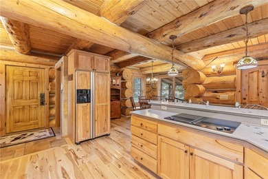 An extraordinary log home surrounded by mature trees and on Red Lodge Golf Club in Montana - for sale on GolfHomes.com, golf home, golf lot