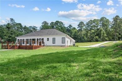 STUNNING MODERN LAKEFRONT HOME ON LAKE SINCLAIR! This sleek and on Milledgeville Country Club in Georgia - for sale on GolfHomes.com, golf home, golf lot