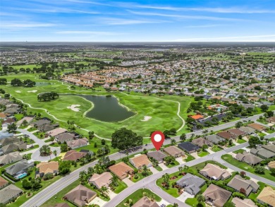 This Custom expanded Gardenia Model has pictuesqes views through on Truman Executive Golf Course in Florida - for sale on GolfHomes.com, golf home, golf lot