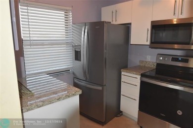 Retirement living at its finest! This stunning, updated 2/2 unit on Sunrise Lakes Phase IV Golf Course in Florida - for sale on GolfHomes.com, golf home, golf lot