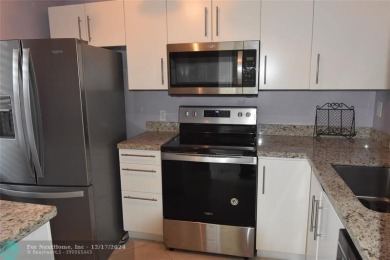Retirement living at its finest! This stunning, updated 2/2 unit on Sunrise Lakes Phase IV Golf Course in Florida - for sale on GolfHomes.com, golf home, golf lot
