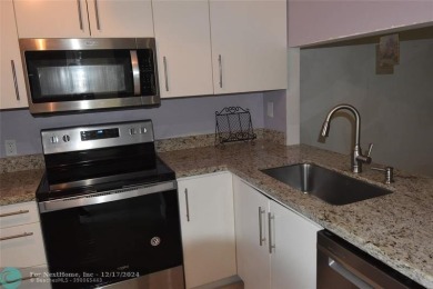 Retirement living at its finest! This stunning, updated 2/2 unit on Sunrise Lakes Phase IV Golf Course in Florida - for sale on GolfHomes.com, golf home, golf lot