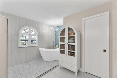 Welcome to your peaceful Apollo Beach retreat--tasteful on Apollo Beach Golf and Sea Club in Florida - for sale on GolfHomes.com, golf home, golf lot