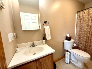 Welcome to your up north getaway! This charming 2-bedroom on Lakeside Golf Course in Michigan - for sale on GolfHomes.com, golf home, golf lot