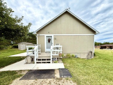 Welcome to your up north getaway! This charming 2-bedroom on Lakeside Golf Course in Michigan - for sale on GolfHomes.com, golf home, golf lot