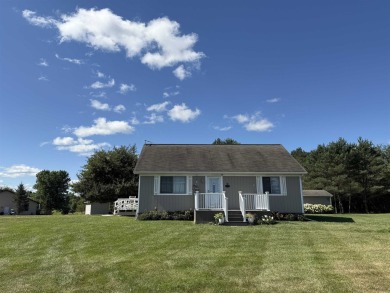 Welcome to your up north getaway! This charming 2-bedroom on Lakeside Golf Course in Michigan - for sale on GolfHomes.com, golf home, golf lot