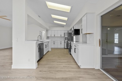 Welcome home to this completely renovated home from top to on Timber Pines Golf Course in Florida - for sale on GolfHomes.com, golf home, golf lot