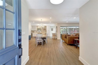 This beautifully maintained 3-bedroom, 2-bath pool home is on Palm Aire Country Club of Sarasota in Florida - for sale on GolfHomes.com, golf home, golf lot
