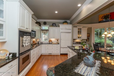 Experience elegant living in this stunning golf front home on Pinewild Country Club of Pinehurst in North Carolina - for sale on GolfHomes.com, golf home, golf lot