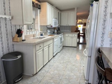 Step Inside This Exceptional Home: Your Dream Awaits!    Homes on Four Lakes Golf Club in Florida - for sale on GolfHomes.com, golf home, golf lot