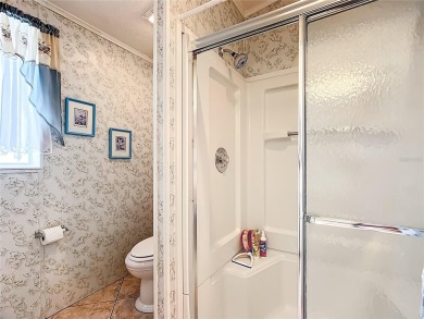 Step inside and feel at home instantly in this beautifully on Lily Lake Golf and RV Resort in Florida - for sale on GolfHomes.com, golf home, golf lot