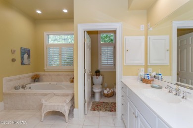 Experience elegant living in this stunning golf front home on Pinewild Country Club of Pinehurst in North Carolina - for sale on GolfHomes.com, golf home, golf lot