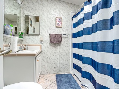 Step inside and feel at home instantly in this beautifully on Lily Lake Golf and RV Resort in Florida - for sale on GolfHomes.com, golf home, golf lot